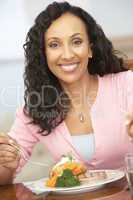 Woman Enjoying A Meal At Home