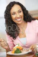 Woman Enjoying A Meal At Home