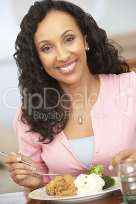 Woman Enjoying A Meal At Home