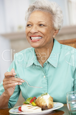 Woman Enjoying A Meal At Home