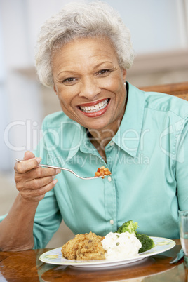 Woman Enjoying A Meal At Home