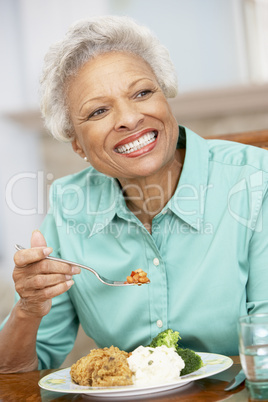 Woman Enjoying A Meal At Home