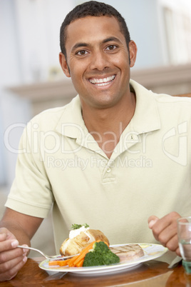 Man Enjoying A Meal At Home Man Enjoying A Meal At Home