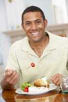 Man Enjoying A Meal At Home