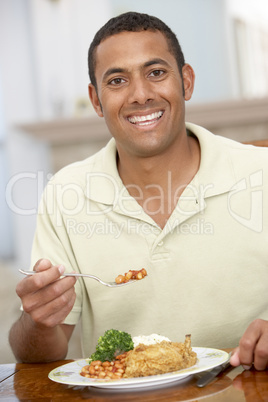 Man Enjoying A Meal At Home