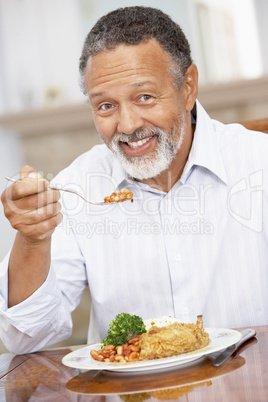 Man Enjoying A Meal At Home