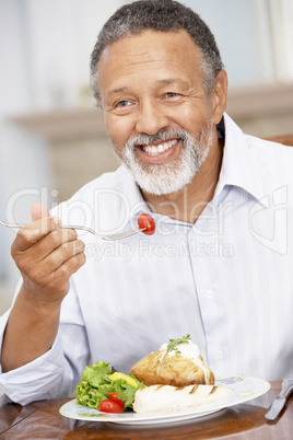 Man Enjoying A Meal At Home