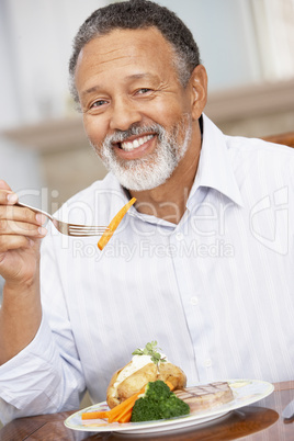 Man Enjoying A Meal At Home