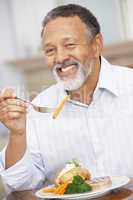 Man Enjoying A Meal At Home