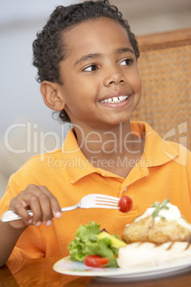 Young Boy Enjoying A Meal At Home