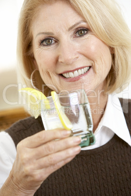 Woman Having A Drink At Home