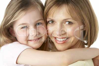 Mother And Daughter Smiling And Hugging