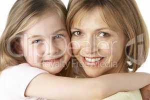 Mother And Daughter Smiling And Hugging