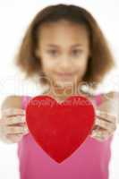 Young Girl Holding Heart