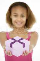 Young Girl Holding Wrapped Gift