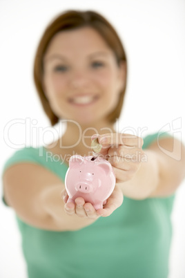 Woman Holding Piggy Bank