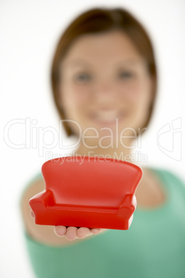 Woman Holding Small Sofa