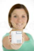 Woman Holding Model Telephone