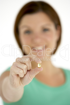 Woman Holding Vitamin Capsule