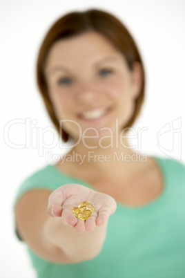 Woman Holding Vitamin Capsules