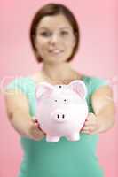 Woman Holding Piggy Bank