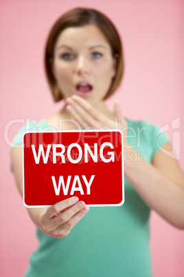 Woman Holding Road Traffic Sign