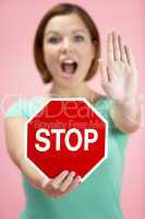 Woman Holding Road Traffic Sign