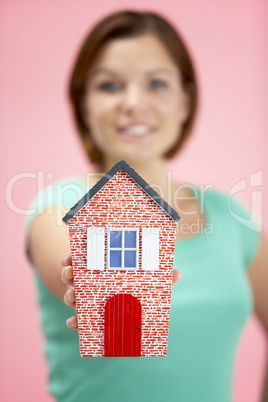 Woman Holding Model House