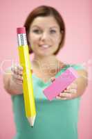 Woman Holding Big Pencil And Eraser