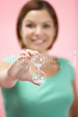 Woman Holding Hourglass