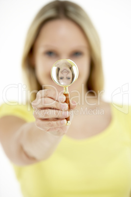 Woman Holding Magnifying Glass