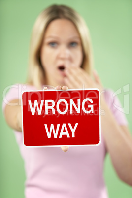 Woman Holding Road Traffic Sign