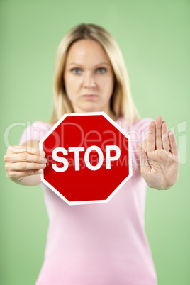 Woman Holding Road Traffic Sign