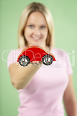 Woman Holding Toy Car