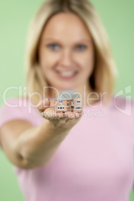 Woman Holding Model House