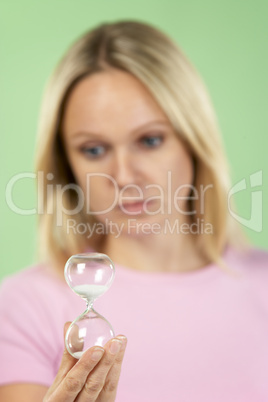 Woman Holding Hourglass