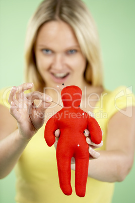 Woman Holding Voodoo Doll