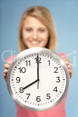 Teenage Girl Holding Clock