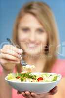 Teenage Girl Holding Bowl Of Salad