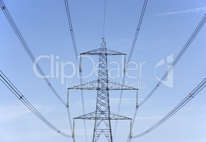 Electricity Pylons Against A Blue Sky