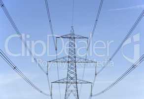 Electricity Pylons Against A Blue Sky