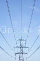 Electricity Pylons Against A Blue Sky