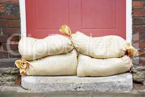 Sandbags Stacked In A Doorway In Preparation For Flooding