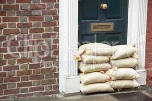 Sandbags Stacked In A Doorway In Preparation For Flooding