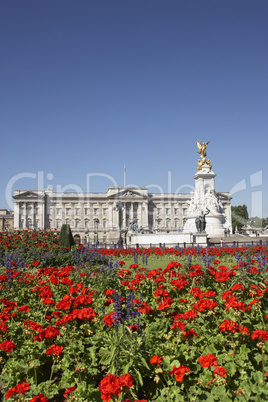 Buckingham Palace With Flowers Blooming In The Queen's Garden, L