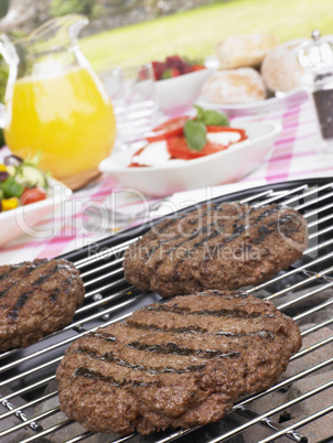 Burgers Cooking On Barbeque Grill