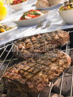 Steak Cooking On A Grill