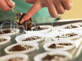 Putting Chocolate Cupcake Mix Into Baking Tin