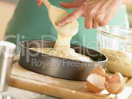 Pouring Cake Mixture Into Baking Tin