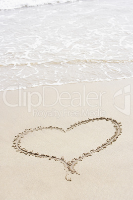 Heart Shape Drawn In The Sand On The Beach